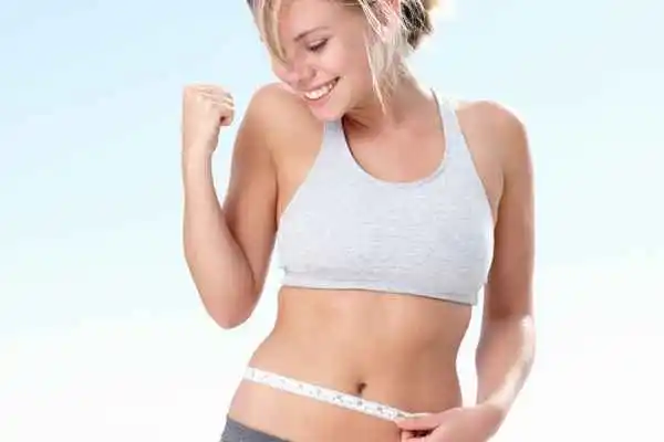 woman happy after fat reduction treatment Hampton Wick