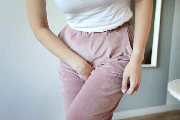 woman struggling with urine incontinence Hampton Wick